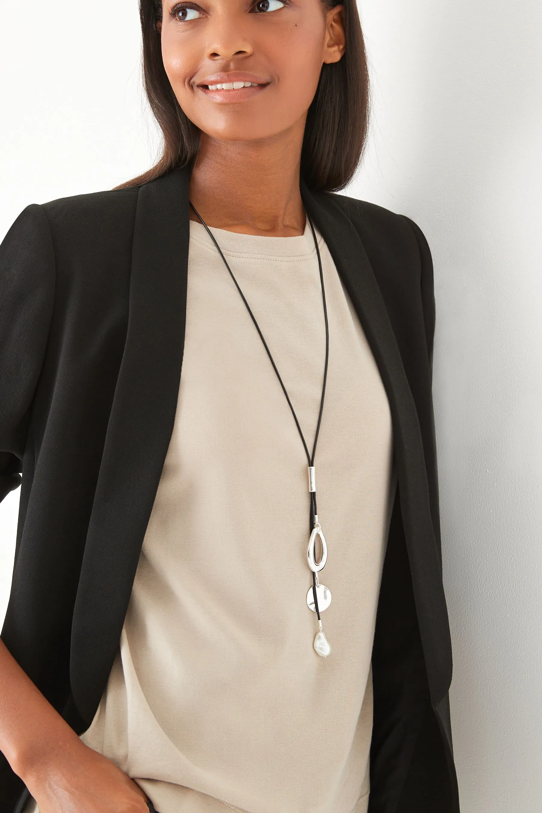 Black - Cord necklace with cluster pendant.