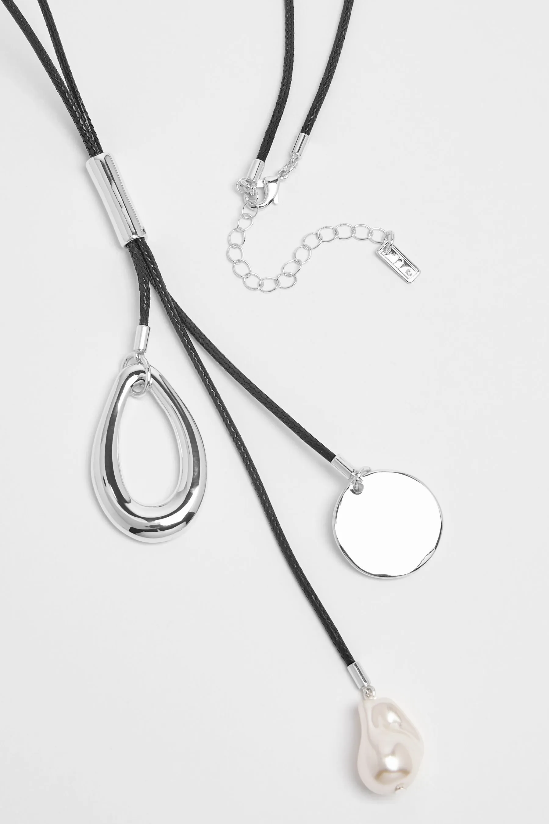 Black - Cord necklace with cluster pendant.