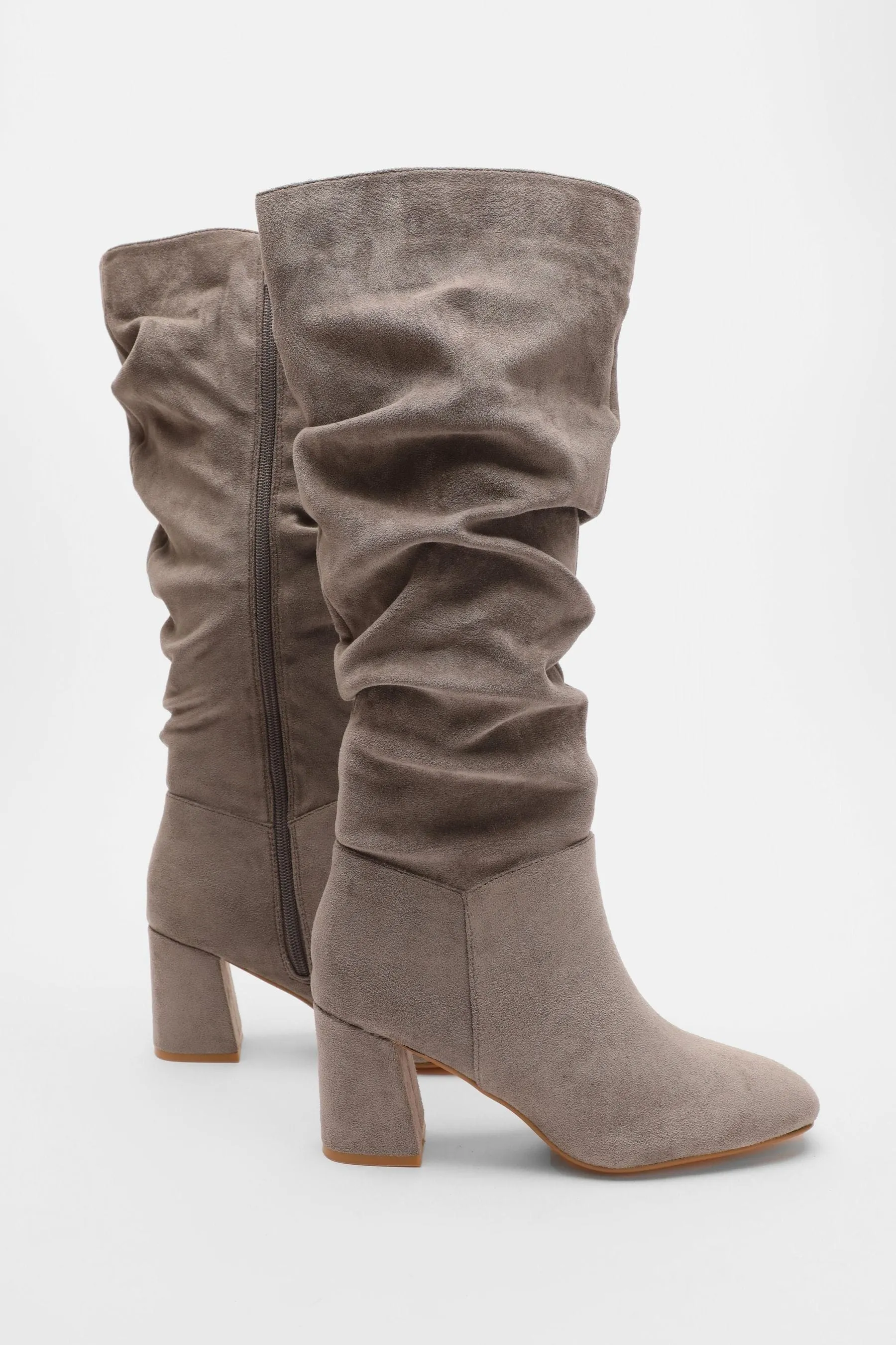 Knee-high boots with ruching and chunky heel quiz.
