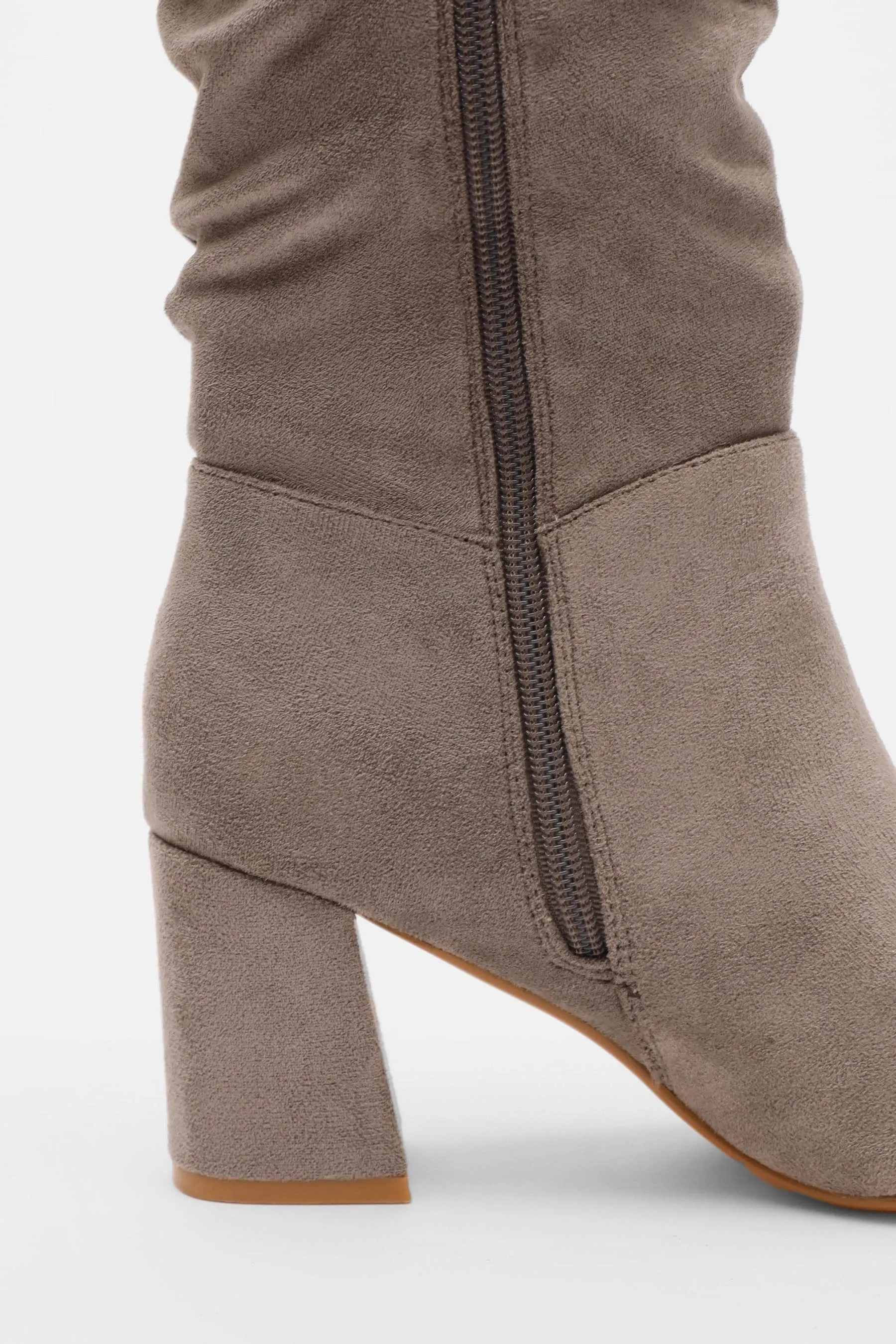 Knee-high boots with ruching and chunky heel quiz.
