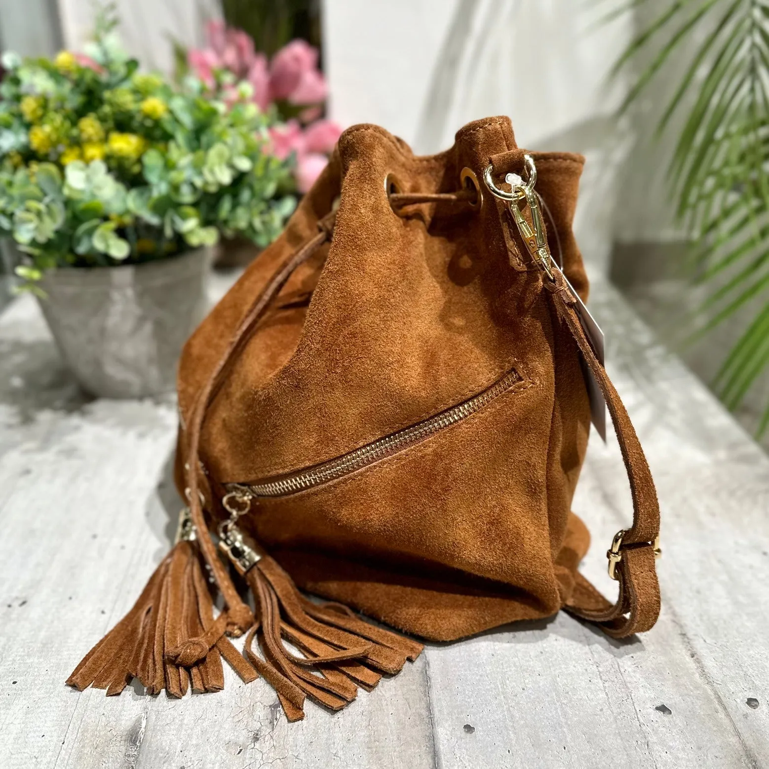 Leather Suede Bucket Bag with Tassel Details and Dual Zippers