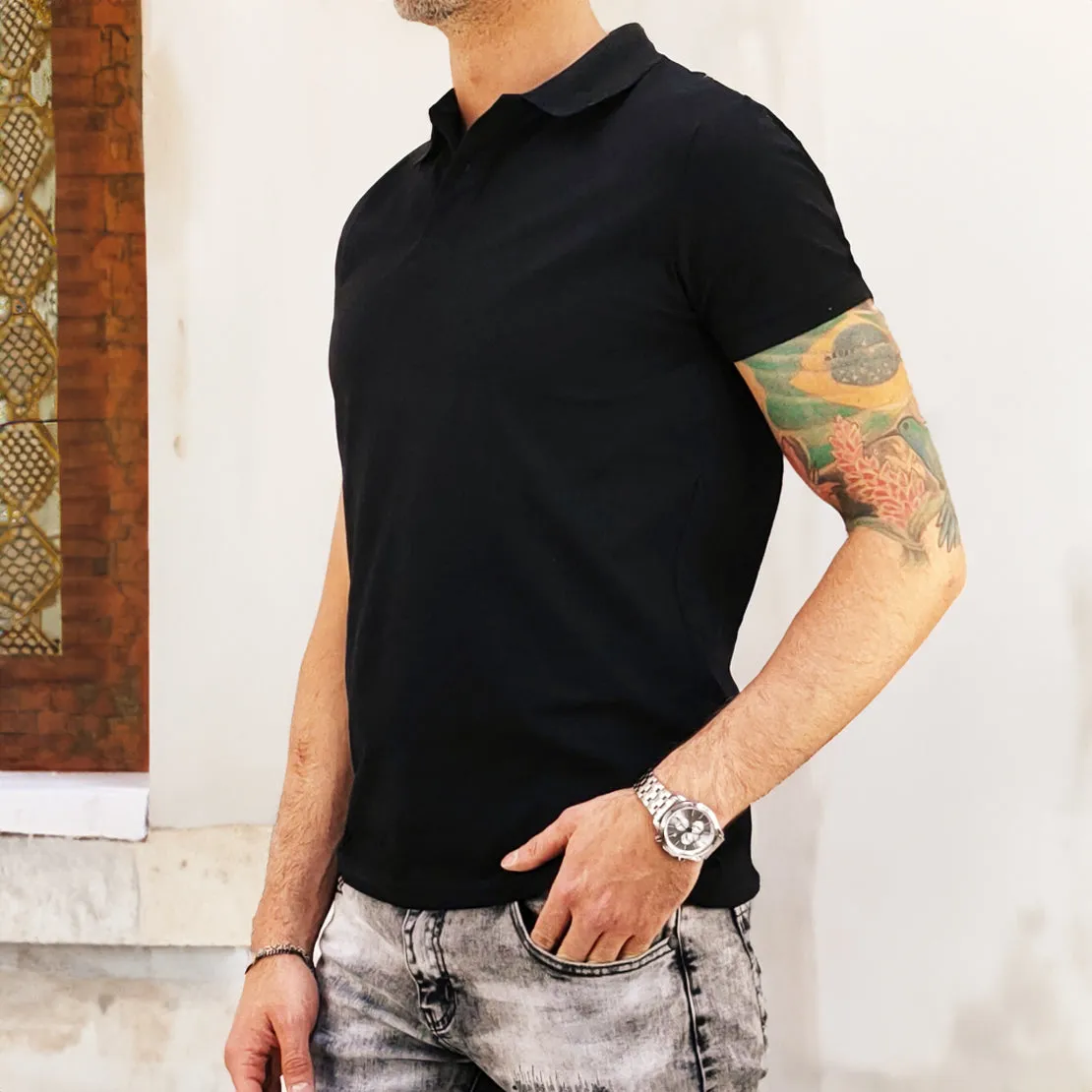 Short-sleeved black polo shirt.