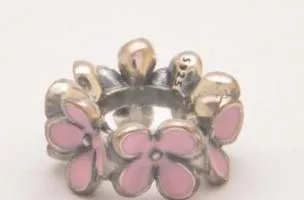 Silver floral pendant with rose motif.